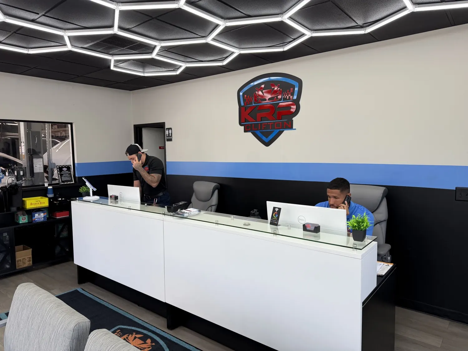 KRP Automotive team members at the front desk in Clifton, New Jersey