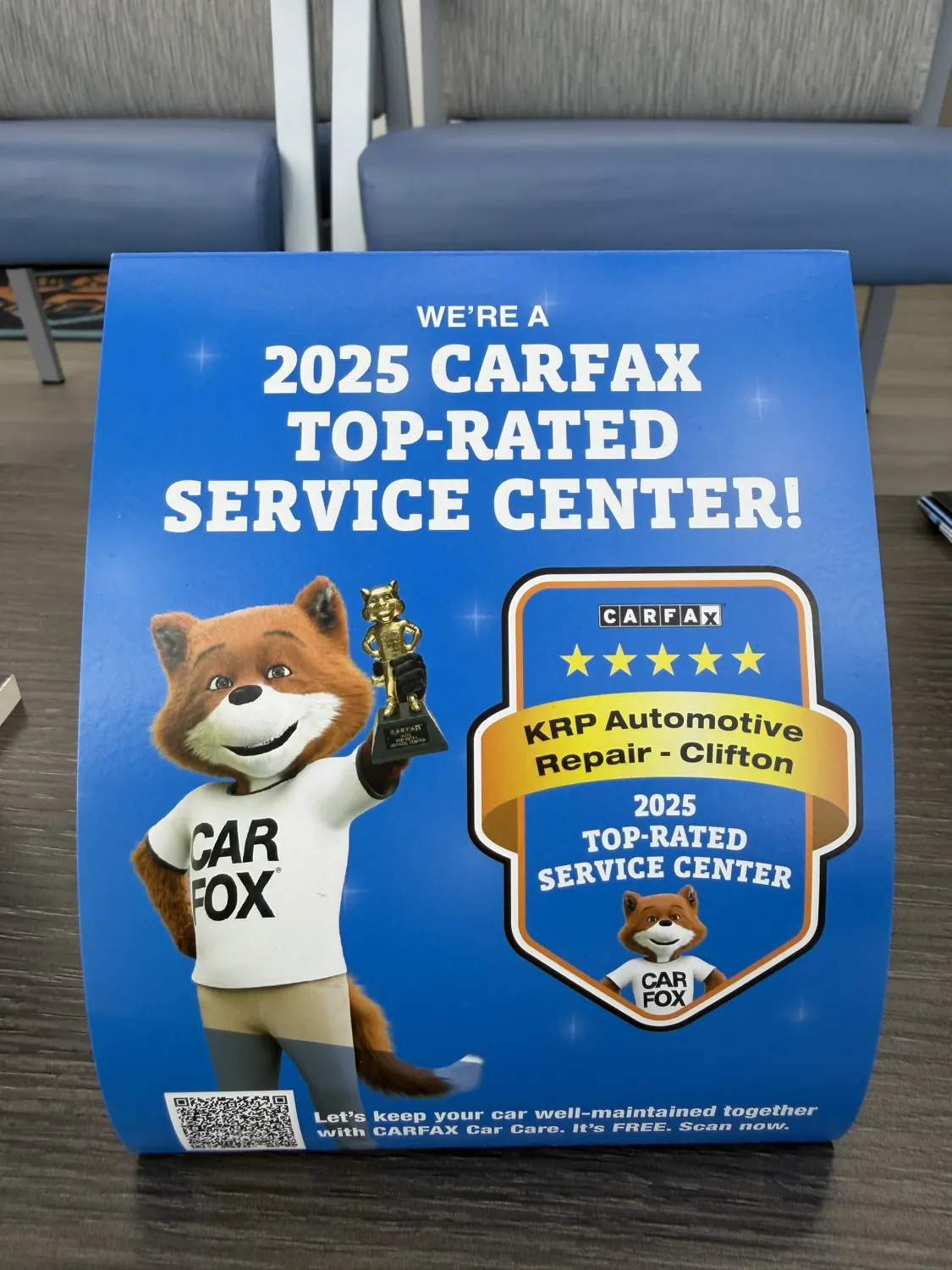 The Carfax Top-Rated award beside the lifetime warranty sign at KRP Automotive