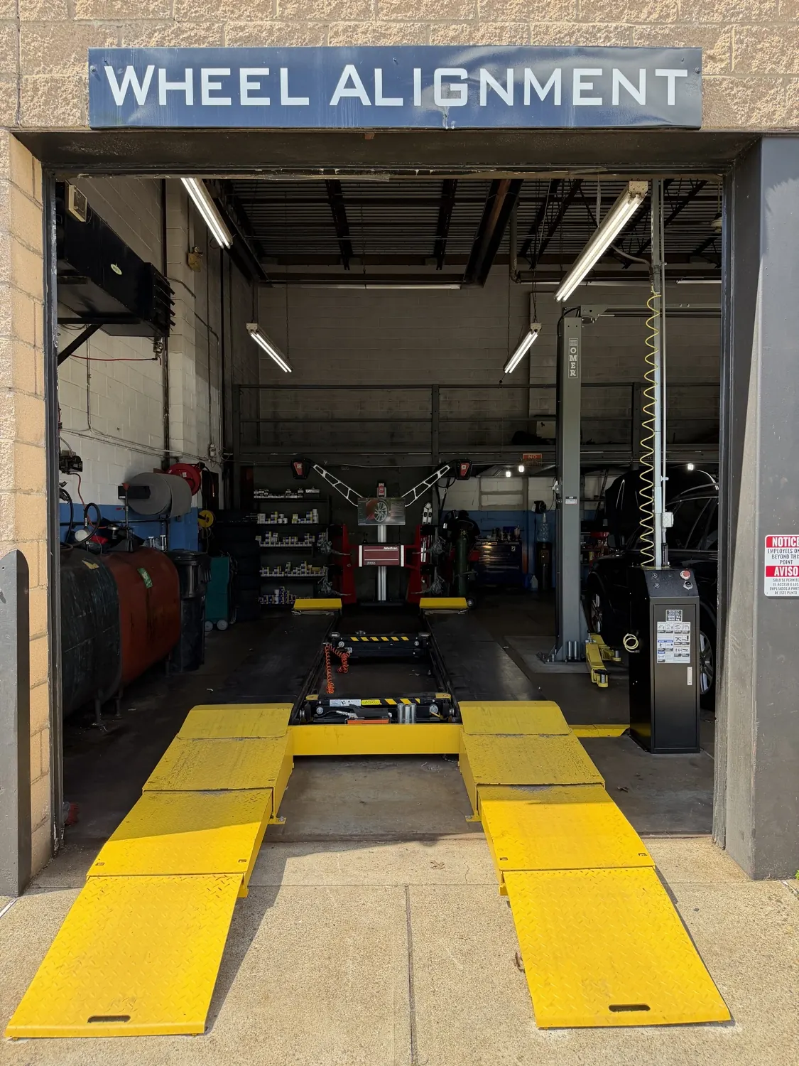 Wheel alignment equipment in use at KRP Automotive Repair in Clifton, NJ