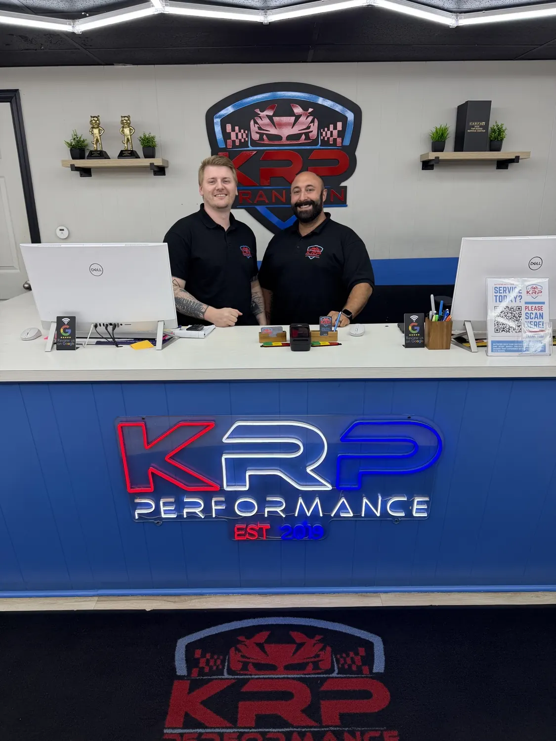 Two KRP Automotive team members at the Franklin front desk
