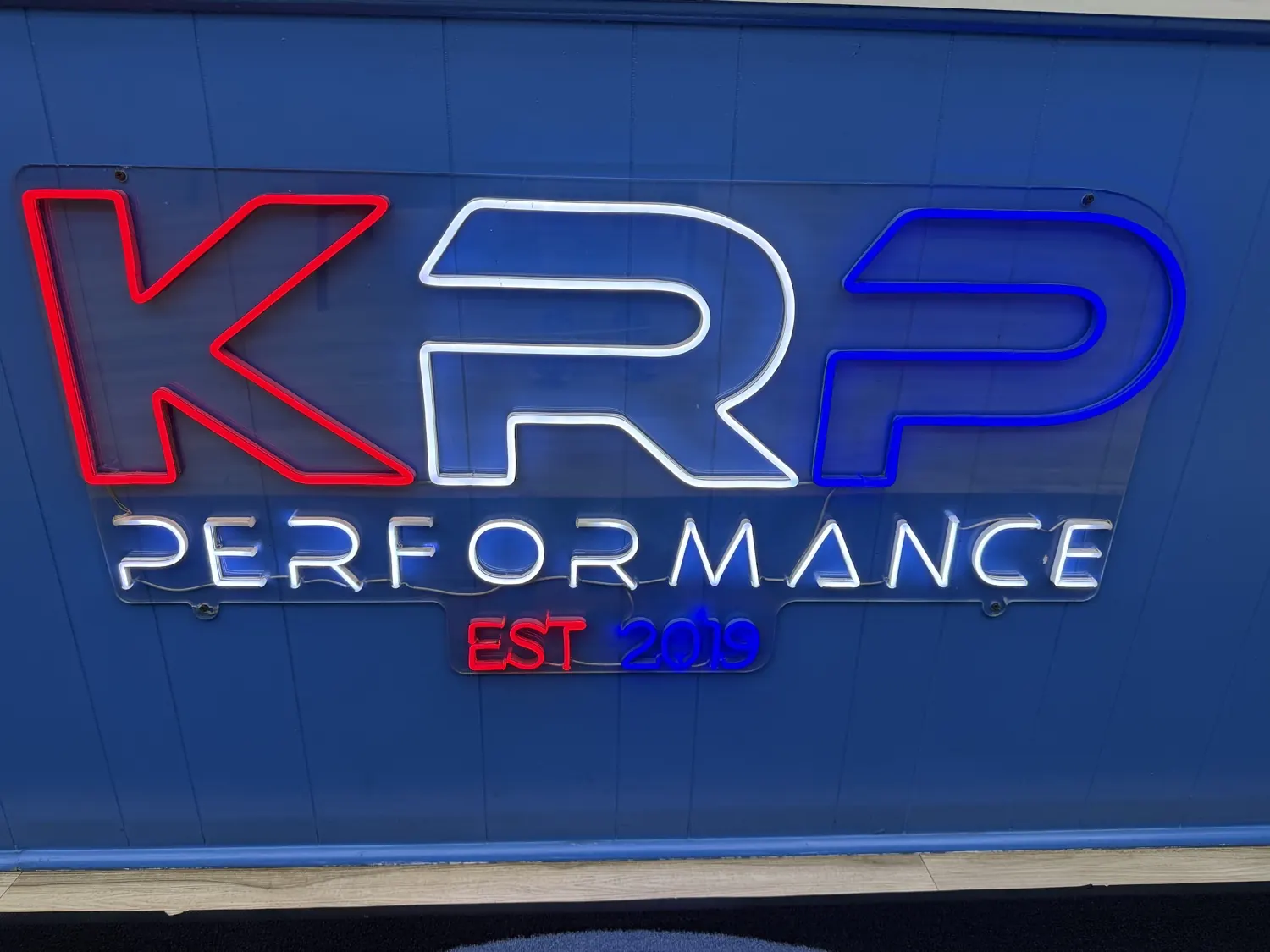 The KRP Performance neon sign in the Franklin lobby