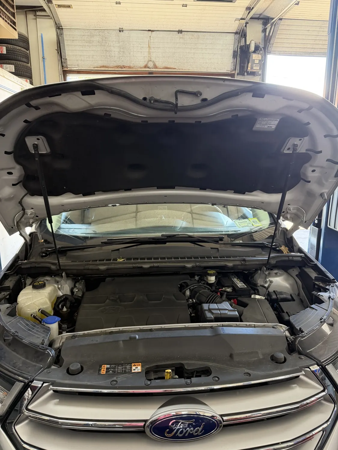 Cooling-system service under the hood at KRP Automotive Repair in Newton, NJ